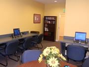 Dundalk apartment for rent - a conference room with computers and a table with flowers
