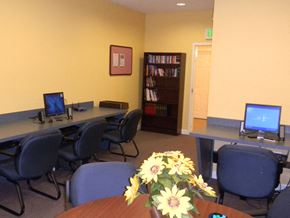 Dundalk apartment for rent - a conference room with computers and a table with flowers