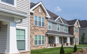 North East apartment for rent - a view of the front of a house with stone and gray siding