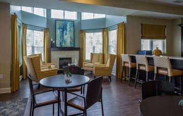 North East apartment for rent - a living room with tables and chairs and a fireplace