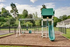 Williamsville apartment for rent - a playground with a swing set and a slide