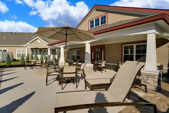 Outdoor patio with gas grill and fire pit