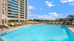 Chicago apartment for rent - A close view of the outdoor pool and sundeck at Eleven Thirty on a sunny day.