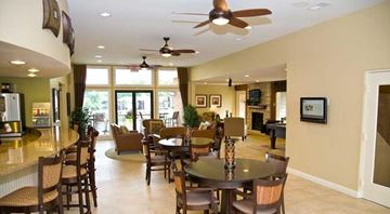 St. Louis apartment for rent - a dining room and living room with a table and chairs