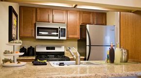 St. Louis apartment for rent - a kitchen with a stove microwave and refrigerator