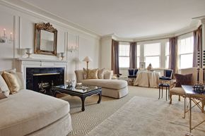 Chicago apartment for rent - A living room with a fireplace, sofas, and a coffee table.
