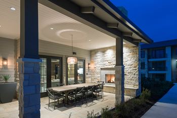 Outdoor dining area with fireplace