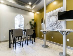 Cypress apartment for rent - a dining room with a table and chairs and a television