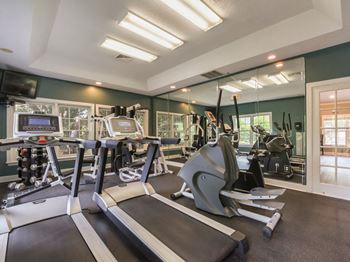 24-Hour fitness center cardio and free weight equipment