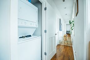 Chicago apartment for rent - a white kitchen with an oven and a washing machine