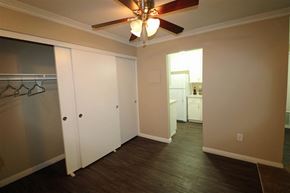 Fullerton apartment for rent - a living room with a ceiling fan and a closet