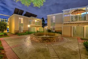 Fullerton apartment for rent - a courtyard with a fountain in the middle of some buildings
