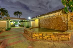Fullerton apartment for rent - a hot tub sits in the middle of a building at night