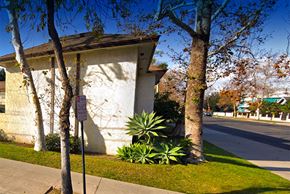Santa Ana apartment for rent - a building with a sign on the side of a street