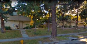Anaheim apartment for rent - a neighborhood with trees and a yellow house