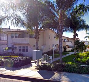 Laguna Beach triplex for rent - a house with palm trees in front of it