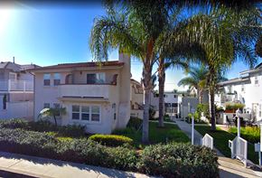 Laguna Beach triplex for rent - a house with palm trees in front of it