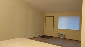 Circleville apartment for rent - Image of carpeted living room and door