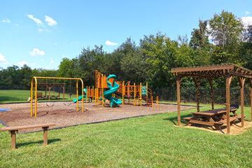 Murfreesboro apartment for rent - a playground with a swing set and a pavilion