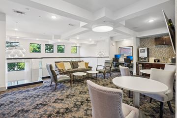 Brentwood apartment for rent - A living room with a white table and chairs.