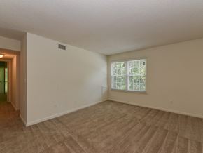 Suffolk apartment for rent - the living room of an empty house with a window
