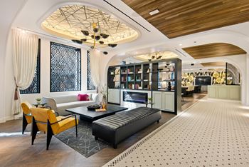 Posh lounge area with fireplace in clubhouse