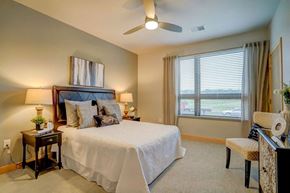 Verona apartment for rent - a bedroom with a large bed and a ceiling fan