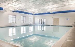 Malmstrom Afb apartment for rent - a large swimming pool in a building with a ceiling