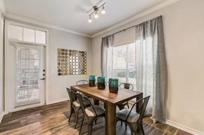 Coppell apartment for rent - a dining room with a table and chairs and a window