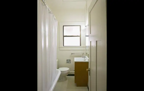 Oakland apartment for rent - a bathroom with a toilet and a sink and a window