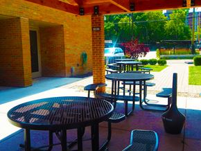 Evanston apartment for rent - a patio with tables and chairs outside of a building
