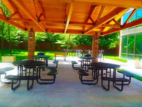 Evanston apartment for rent - a patio with tables and chairs under a pavilion