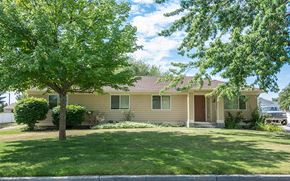 Fairchild Afb apartment for rent - a house with a lawn and trees in front of it