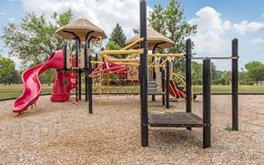 Grand Forks Afb apartment for rent - a playground with a pink slide and other playground equipment