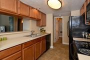 St. Petersburg townhouse for rent - Kitchen with black appliances at Alta Mar at Broadwater Apartments, Florida