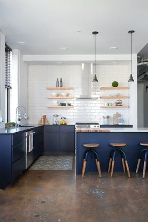 Milwaukee apartment for rent - A kitchen with a bar area and stools.