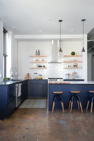Milwaukee apartment for rent - A kitchen with a bar area and stools.