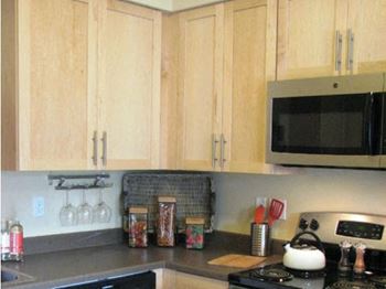 Maple or cherry finish cabinetry