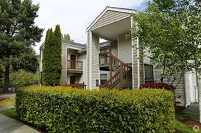 Seattle apartment for rent - the front of a house with a hedge in front of it