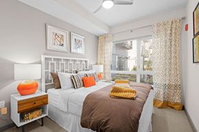Auburn apartment for rent - a bedroom with a large bed and a window