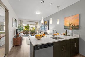 Auburn apartment for rent - a kitchen with a sink and a counter top in a living room