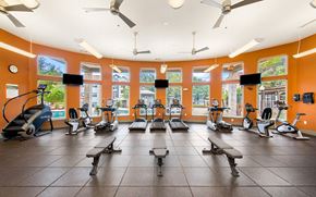 San Antonio apartment for rent - a gym with treadmills and other exercise equipment in a large room with windows