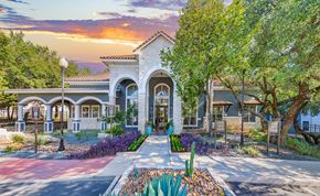 San Antonio apartment for rent - the front of a house with trees and a sidewalk