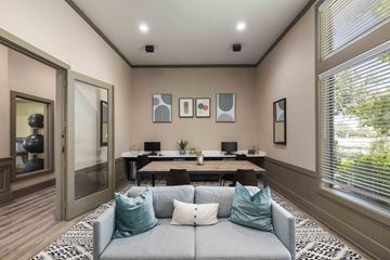 Roanoke apartment for rent - A living room with a grey couch and a wooden table.