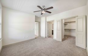 San Antonio apartment for rent - an empty bedroom with a ceiling fan and closet