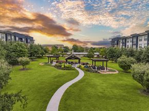 Plano apartment for rent - an aerial view of a park with gazebos and buildings