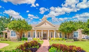 Round Rock apartment for rent - the front of a house with a lawn and trees