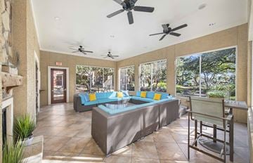 Austin apartment for rent - a living room with couches and a table with a pool