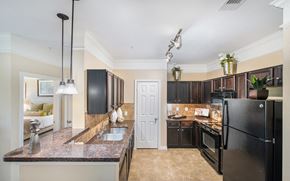 Fairview apartment for rent - a kitchen with black appliances and granite counter tops