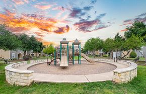 Round Rock apartment for rent - the preserve at ballantyne commons park playground at sunset